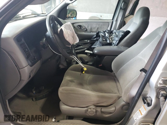 2001 Mazda Tribute LX with VIN 4F2CU08141KM65160, listed as a Copart auction lot 60895624 with 255,194 mi miles and Salvage Title. Bid and sale history available at DreamBid. Image 7.