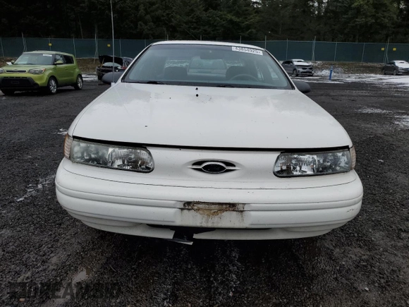 1994 Ford Taurus z VIN 1FALP5344RA291510, wystawiony jako Copart lot #43854925 z przebiegiem 69 067 mil mil oraz Tytuł czysty. Historia ofert i sprzedaży dostępna na DreamBid. Obrazek 5.