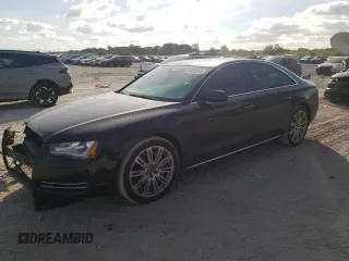 2013 Audi A8 3.0L with VIN WAUAGAFDXDN032766, listed as a Copart auction lot 84275944 with 127,388 mi miles and Salvage title. Bid and sale history available at DreamBid. Image 1.