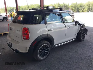 2015 MINI Countryman S z VIN WMWZC5C56FWP45194, wystawiony jako IAAI lot #40300703 z przebiegiem 95 760 mil mil oraz . Historia ofert i sprzedaży dostępna na DreamBid. Obrazek 4.