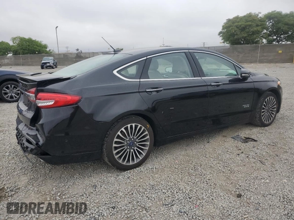 2017 Ford Fusion Titanium z VIN 3FA6P0SU5HR105415, wystawiony jako Copart lot #59779715 z przebiegiem 88 988 mil mil oraz Szkoda całkowita • Salvage title. Historia ofert i sprzedaży dostępna na DreamBid. Obrazek 3.