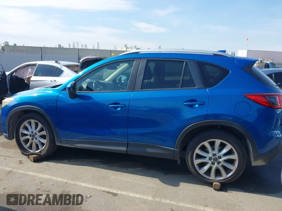 2014 Mazda CX-5 Grand Touring with VIN JM3KE4DY1E0327703, listed as a IAAI auction lot 41755735 with 206,845 mi miles. Bid and sale history available at carsss.com. Image 14.