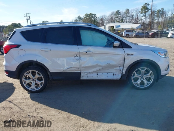 2019 Ford Escape Titanium with VIN 1FMCU9J91KUB21842, listed as a IAAI auction lot 41632210 with 104,900 mi miles. Bid and sale history available at carsss.com. Image 13.