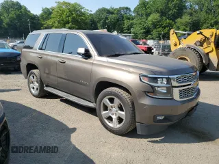 2016 Chevrolet Tahoe LT with VIN 1GNSCBKCXGR241872, listed as a Copart auction lot 59628315 with 156,862 mi miles and Salvage title. Bid and sale history available at DreamBid. Image 4.