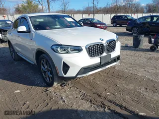 2022 BMW X4 xDrive30i with VIN 5UX33DT05N9L03865, listed as a IAAI auction lot 41216034 with 69,376 mi miles. Bid and sale history available at carsss.com. Image 1.