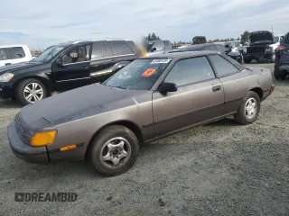 1986 Toyota Celica z VIN JT2ST64C2G7027377, wystawiony jako Copart lot #47088125 z przebiegiem 724 249 mil mil oraz Czysty tytuł • Clean title. Historia ofert i sprzedaży dostępna na DreamBid. Obrazek 1.