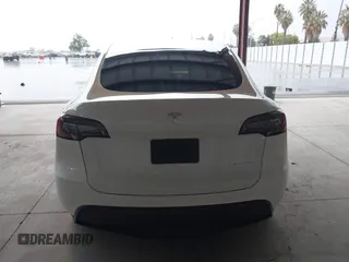 2023 Tesla Model Y Long Range z VIN 7SAYGDEE2PF834036, wystawiony jako IAAI lot #41933120 z przebiegiem 27 872 mil mil oraz . Historia ofert i sprzedaży dostępna na DreamBid. Obrazek 17.