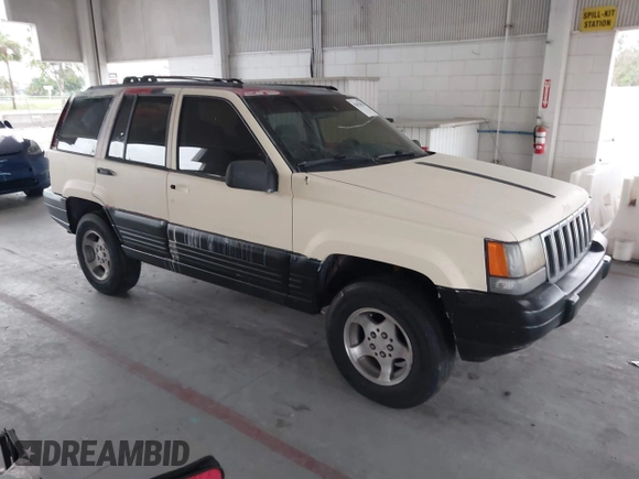 1996 Jeep Grand Cherokee Laredo z VIN 1J4FX58S7TC157272, wystawiony jako IAAI lot #42422023 z przebiegiem 229 170 mil mil oraz . Historia ofert i sprzedaży dostępna na DreamBid. Obrazek 1.