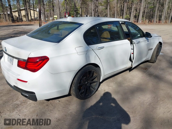 2014 BMW 7 Series 740Li with VIN WBAYE4C59ED138409, listed as a IAAI auction lot 41785423 with 121,687 mi miles. Bid and sale history available at carsss.com. Image 4.