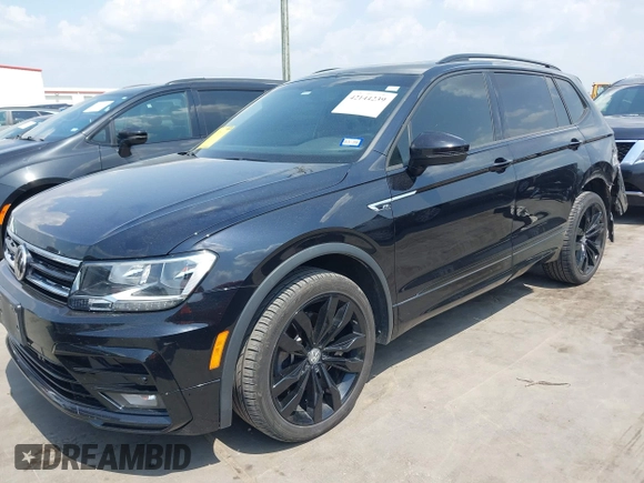 2021 Volkswagen Tiguan SE z VIN 3VV3B7AX0MM047478, wystawiony jako IAAI lot #42144239 z przebiegiem 55 468 mil mil oraz . Historia ofert i sprzedaży dostępna na DreamBid. Obrazek 18.