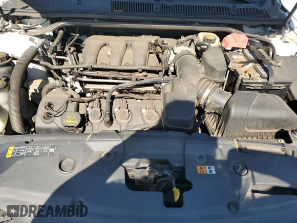 2014 Ford Taurus SE with VIN 1FAHP2D8XEG112805, listed as a Copart auction lot 48975265 with 127,730 mi miles and Salvage Title. Bid and sale history available at DreamBid. Image 11.