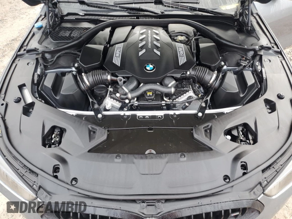2023 BMW 8 Series M850i z VIN WBAGV8C02PCL20503, wystawiony jako Copart lot #84214214 z przebiegiem Nie podano mil oraz Szkoda całkowita • Salvage title. Historia ofert i sprzedaży dostępna na DreamBid. Obrazek 11.