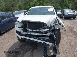 2021 Toyota Tacoma 4WD SR with VIN 3TMCZ5AN2MM414975, listed as a IAAI auction lot 41997227 with 57,729 mi miles. Bid and sale history available at carsss.com. Image 12.