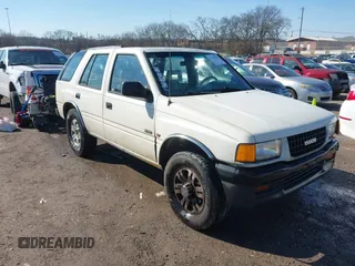 1997 Isuzu Rodeo z VIN 4S2CK58V2V4300048, wystawiony jako IAAI lot #41446738 z przebiegiem 195 609 mil mil oraz . Historia ofert i sprzedaży dostępna na DreamBid. Obrazek 1.