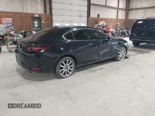 2020 Mazda 3 Premium with VIN 3MZBPBEM4LM123018, listed as a IAAI auction lot 41967652 with 84,642 mi miles and . Bid and sale history available at DreamBid. Image 4.