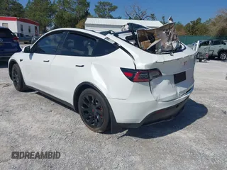 2023 Tesla Model Y Long Range with VIN 7SAYGAEE1PF665934, listed as a IAAI auction lot 41780949 with 21,949 mi miles and . Bid and sale history available at DreamBid. Image 3.