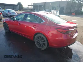 2016 Mazda 6 i Grand Touring with VIN JM1GJ1W57G1438524, listed as a IAAI auction lot 41365211 with 162,678 mi miles and . Bid and sale history available at DreamBid. Image 3.