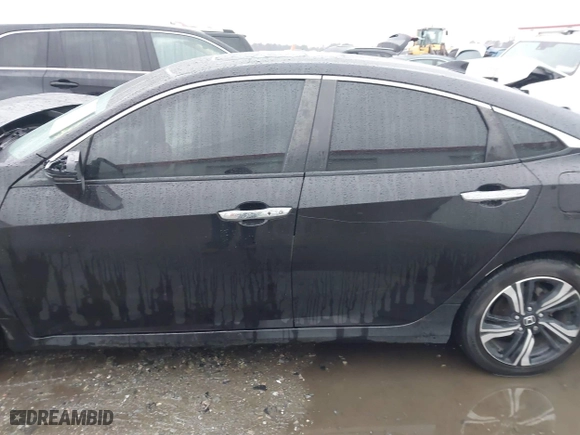 2017 Honda Civic Sedan Touring with VIN 2HGFC1F99HH658034, listed as a IAAI auction lot 41563627 with 140,819 mi miles. Bid and sale history available at carsss.com. Image 14.