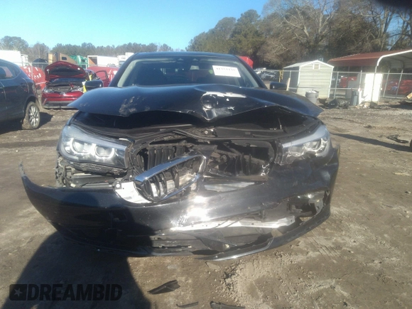 2018 BMW 7 Series 740i with VIN WBA7E2C57JG742257, listed as a IAAI auction lot 41353435 with 77,125 mi miles. Bid and sale history available at carsss.com. Image 13.