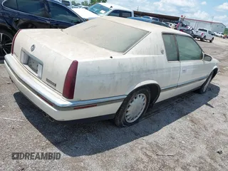 1994 Cadillac Eldorado ESC z VIN 1G6EL12Y4RU604343, wystawiony jako IAAI lot #42221885 z przebiegiem Nie podano mil oraz . Historia ofert i sprzedaży dostępna na DreamBid. Obrazek 4.