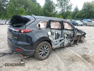 2023 Mazda CX-9 Touring z VIN JM3TCBCY5P0647237, wystawiony jako Copart lot #56338625 z przebiegiem Nie podano mil oraz Szkoda całkowita • Salvage title. Historia ofert i sprzedaży dostępna na DreamBid. Obrazek 3.