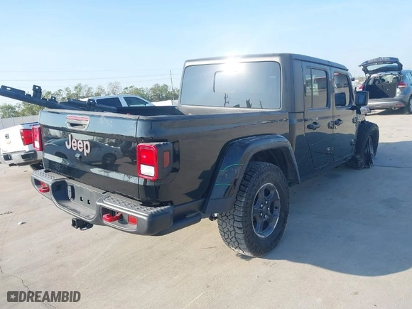 2023 Jeep Gladiator Rubicon with VIN 1C6JJTBGXPL543787, listed as a IAAI auction lot 40963799 with 5,402 mi miles. Bid and sale history available at carsss.com. Image 4.