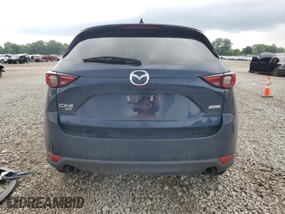 2019 Mazda CX-5 Grand Touring with VIN JM3KFBDM4K0676946, listed as a Copart auction lot 61040465 with Not provided miles and Salvage title. Bid and sale history available at DreamBid. Image 6.