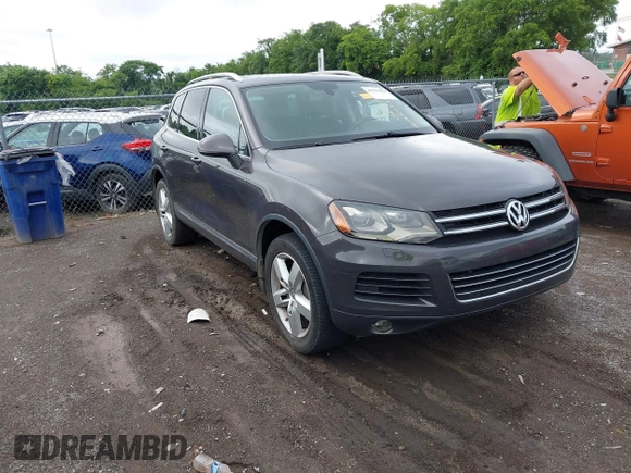 2012 Volkswagen Touareg Sport with VIN WVGFK9BP0CD002939, listed as a IAAI auction lot 42531654 with 222,435 mi miles and . Bid and sale history available at DreamBid. Image 1.