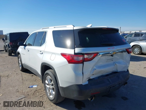 2018 Chevrolet Traverse LT Cloth z VIN 1GNERGKW9JJ214512, wystawiony jako IAAI lot #41397519 z przebiegiem 100 342 mil mil oraz . Historia ofert i sprzedaży dostępna na DreamBid. Obrazek 3.