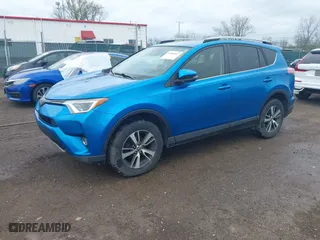 2017 Toyota RAV4 XLE with VIN JTMRFREV4HJ123496, listed as a IAAI auction lot 42068817 with 211,682 mi miles. Bid and sale history available at carsss.com. Image 2.