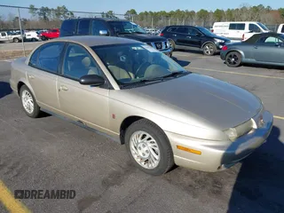 1999 Saturn SL with VIN 1G8ZK5270XZ155530, listed as a IAAI auction lot 41662250 with 210,424 mi miles. Bid and sale history available at carsss.com. Image 1.