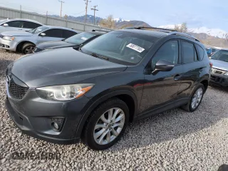 2015 Mazda CX-5 Grand Touring with VIN JM3KE4DY3F0495411, listed as a Copart auction lot 50077765 with 136,191 mi miles and Salvage Title. Bid and sale history available at DreamBid. Image 1.
