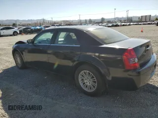 2009 Chrysler 300 LX with VIN 2C3KA43D59H529761, listed as a Copart auction lot 44260275 with 135,802 mi miles and Salvage Title. Bid and sale history available at carsss.com. Image 2.
