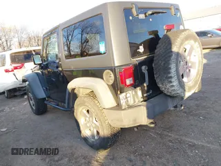 2011 Jeep Wrangler Rubicon with VIN 1J4HA6D11BL564211, listed as a IAAI auction lot 41242240 with 124,039 mi miles and . Bid and sale history available at carsss.com. Image 3.