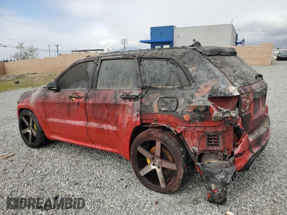 2012 Jeep Grand Cherokee SRT8 with VIN 1C4RJFDJ7CC217641, listed as a Copart auction lot 44060105 with 108,858 mi miles and Salvage Title. Bid and sale history available at carsss.com. Image 2.