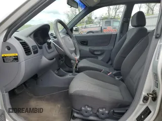 2004 Hyundai Accent GL with VIN KMHCG45C94U515186, listed as a Copart auction lot 52697284 with 49,236 mi miles and Salvage Title. Bid and sale history available at carsss.com. Image 7.