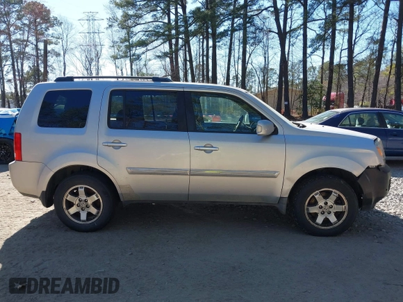 2010 Honda Pilot Touring with VIN 5FNYF4H91AB020868, listed as a IAAI auction lot 41783104 with 298,022 mi miles and . Bid and sale history available at carsss.com. Image 13.