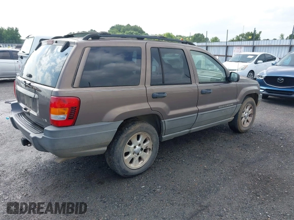 2001 Jeep Grand Cherokee Laredo z VIN 1J4GX48N51C548958, wystawiony jako IAAI lot #42460303 z przebiegiem 210 379 mil mil oraz . Historia ofert i sprzedaży dostępna na DreamBid. Obrazek 4.
