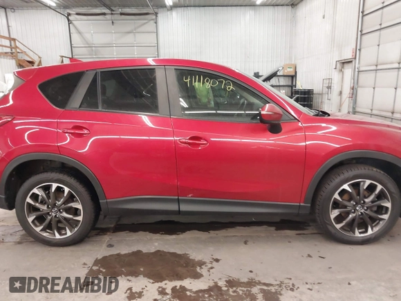 2016 Mazda CX-5 Grand Touring with VIN JM3KE4DY7G0731057, listed as a IAAI auction lot 41118072 with 134,107 mi miles and . Bid and sale history available at carsss.com. Image 14.