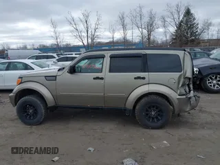 2007 Dodge Nitro SLT z VIN 1D8GU58K97W700047, wystawiony jako IAAI lot #41805822 z przebiegiem 186 604 mil mil oraz . Historia ofert i sprzedaży dostępna na DreamBid. Obrazek 13.