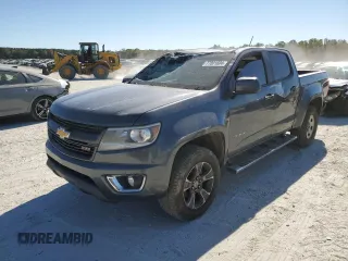 2015 Chevrolet Colorado 4WD Z71 with VIN 1GCGTCE30F1212216, listed as a Copart auction lot 77001604 with 386,335 mi miles and Salvage title. Bid and sale history available at DreamBid. Image 1.