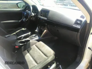 2014 Mazda CX-5 Touring with VIN JM3KE2CY7E0364311, listed as a IAAI auction lot 42108176 with 90,506 mi miles and . Bid and sale history available at DreamBid. Image 5.