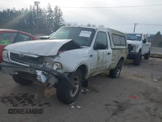 2000 Mazda B-Series 2WD Truck SX with VIN 4F4YR12C4YTM29858, listed as a IAAI auction lot 41473810 with 261,518 mi miles. Bid and sale history available at carsss.com. Image 2.