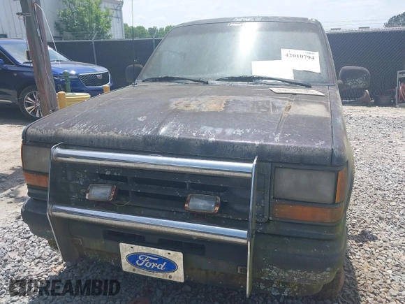 1991 Ford Explorer z VIN 1FMCU24X3MUA54214, wystawiony jako IAAI lot #42010794 z przebiegiem 55 239 mil mil oraz . Historia ofert i sprzedaży dostępna na DreamBid. Obrazek 10.