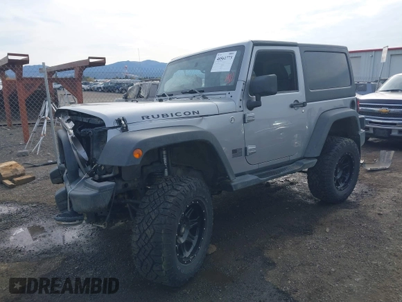 2013 Jeep Wrangler Rubicon 10th Anniversary with VIN 1C4BJWCG8DL639121, listed as a IAAI auction lot 40561773 with 56,023 mi miles and . Bid and sale history available at DreamBid. Image 18.