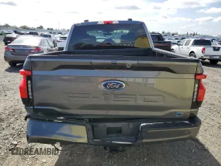 2023 Ford F-150 Lightning Pro z VIN 1FT6W1EV4PWG42053, wystawiony jako Copart lot #50003045 z przebiegiem 29 320 mil mil oraz Szkody całkowita. Historia ofert i sprzedaży dostępna na DreamBid. Obrazek 6.