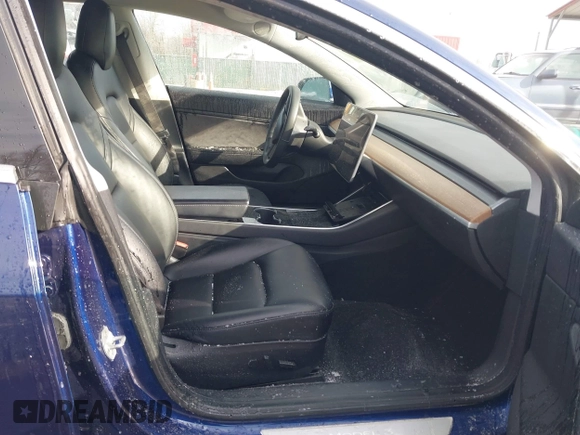 2018 Tesla Model 3 Long Range Battery with VIN 5YJ3E1EB8JF115138, listed as a IAAI auction lot 41343399 with 62,351 mi miles and . Bid and sale history available at DreamBid. Image 5.