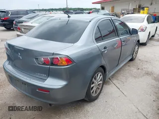 2016 Mitsubishi Lancer ES with VIN JA32U2FU4GU008977, listed as a IAAI auction lot 42139304 with 145,521 mi miles. Bid and sale history available at carsss.com. Image 4.