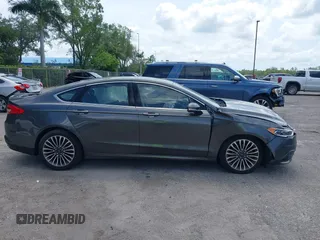 2018 Ford Fusion Titanium with VIN 3FA6P0D9XJR169657, listed as a IAAI auction lot 42392112 with 62,754 mi miles and . Bid and sale history available at DreamBid. Image 14.