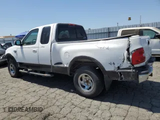 1999 Ford F-150 XL with VIN 1FTRX08LXXKA81637, listed as a Copart auction lot 64637375 with Not provided miles and Salvage title. Bid and sale history available at DreamBid. Image 2.